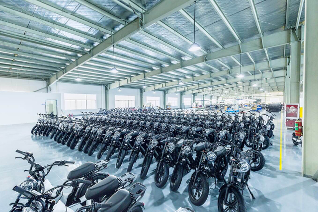 Interior view of Linbo Transportation Tech's warehouse showing neatly organized finished electric vehicles, illustrating efficient storage and inventory management.